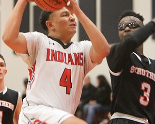 William D. Lewis Girard's David Blackmon(4)shoots past Struther's Kevin Traylor(3) during 12012017 action at Girard.