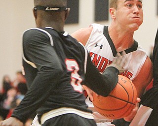 William D. Lewis Girard's Mark Waid (15) drives past Struther's Kevin Traylor(3) during 12012017 action at Girard.