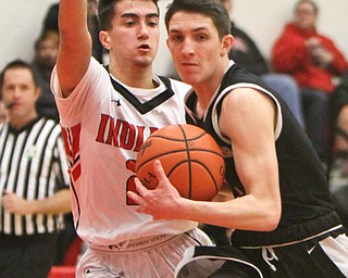 William D. Lewis Girard's Struthers Issiah Torrence(1) keeps the ball from Girard's Austin Clausellduring 12012017 action at Girard.