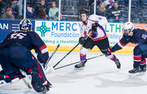 Scott R. Galvin | The Vindicator.Youngstown Phantoms right wing Max Ellis (6) scores a goal against Team USA goalie Spencer Knight during the third period on Friday at the Covelli Centre.