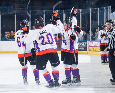 Scott R. Galvin | The Vindicator.Youngstown Phantoms defenseman Michael Joyaux (62) and center Curtis Hall (20) congratulate right wing Max Ellis (6) on his goal against Team USA NTDP on Friday at the Covelli Centre.