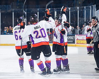 Scott R. Galvin | The Vindicator.Youngstown Phantoms defenseman Michael Joyaux (62) and center Curtis Hall (20) congratulate right wing Max Ellis (6) on his goal against Team USA NTDP on Friday at the Covelli Centre.