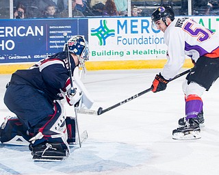 Scott R. Galvin | The Vindicator.Youngstown Phantoms left wing Craig Needham (52) takes a shot against Team USA goalie Spencer Knight during the third period on Friday at the Covelli Centre.