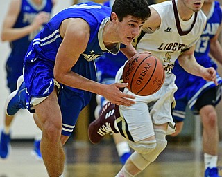 LIBERTY, OHIO - DECEMBER 1, 2017: Poland's Braeden O'Shaungnessy gains possession of the ball after a turnover by Liberty's Kevin Hawn during the first half of their game, Friday night at Liberty High School. DAVID DERMER | THE VINDICATOR