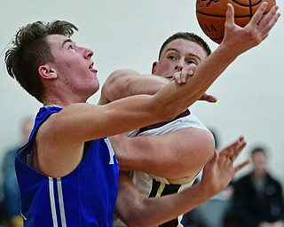 LIBERTY, OHIO - DECEMBER 1, 2017: Poland's Colin Todd is found by Liberty's David Sewell during the first half of their game, Friday night at Liberty High School. DAVID DERMER | THE VINDICATOR