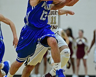 LIBERTY, OHIO - DECEMBER 1, 2017: Poland's Brandon Barringer flies through the air to catch a pass in stride while being pressured by Liberty's Liberty's Kevin Code during the second half of their game, Friday night at Liberty High School. DAVID DERMER | THE VINDICATOR