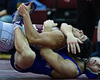 BOARDMAN, OHIO - DECEMBER 3, 2017: Boardman's Brandon Zigotti, top, attempts to break from from the control of Fitch's AJ Stehura during their 170lb bout, Saturday morning at Boardman High School. DAVID DERMER | THE VINDICATOR