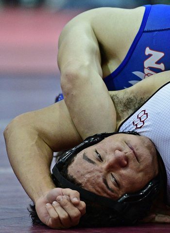 BOARDMAN, OHIO - DECEMBER 3, 2017: Boardman's Brandon Zigotti looks toward the clock while Fitch's AJ Stehura control his body on the mat during their 170lb bout, Saturday morning at Boardman High School. DAVID DERMER | THE VINDICATOR