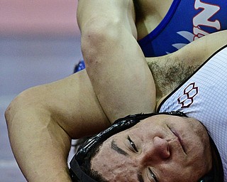 BOARDMAN, OHIO - DECEMBER 3, 2017: Boardman's Brandon Zigotti looks toward the clock while Fitch's AJ Stehura control his body on the mat during their 170lb bout, Saturday morning at Boardman High School. DAVID DERMER | THE VINDICATOR