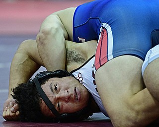 BOARDMAN, OHIO - DECEMBER 3, 2017: Boardman's Brandon Zigotti looks toward the clock while Fitch's AJ Stehura control his body on the mat during their 170lb bout, Saturday morning at Boardman High School. DAVID DERMER | THE VINDICATOR