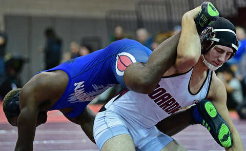 BOARDMAN, OHIO - DECEMBER 3, 2017: Boardman's Michael O'Horo controls the legs of Fitch's Willie Beverly during their 182lb bout, Saturday morning at Boardman High School. DAVID DERMER | THE VINDICATOR