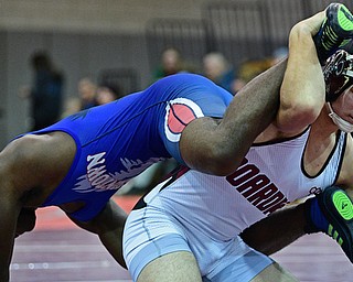 BOARDMAN, OHIO - DECEMBER 3, 2017: Boardman's Michael O'Horo controls the legs of Fitch's Willie Beverly during their 182lb bout, Saturday morning at Boardman High School. DAVID DERMER | THE VINDICATOR