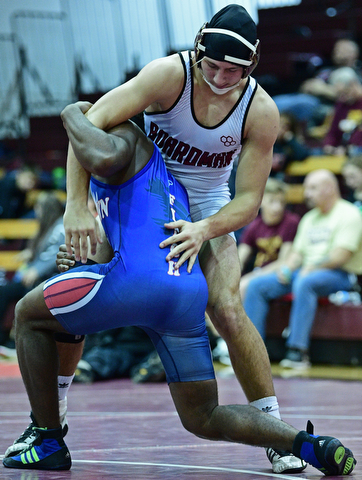 BOARDMAN, OHIO - DECEMBER 3, 2017: Boardman's Michael O'Horo works to prevent Fitch's Willie Beverly from getting back to his feet during their 182lb bout, Saturday morning at Boardman High School. DAVID DERMER | THE VINDICATOR