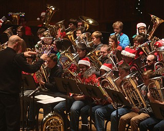Wes O'Connor conducts the concert during a holiday craft show and third annual Tuba Christmas, Sunday, Dec. 3, 2017, at Stambaugh Auditorium in Youngstown...(Nikos Frazier | The Vindicator)
