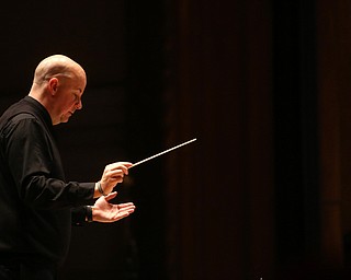 Wes O'Connor conducts the concert during a holiday craft show and third annual Tuba Christmas, Sunday, Dec. 3, 2017, at Stambaugh Auditorium in Youngstown...(Nikos Frazier | The Vindicator)