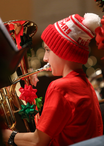 Thomas Russi(13) plays the baritone during a holiday craft show and third annual Tuba Christmas, Sunday, Dec. 3, 2017, at Stambaugh Auditorium in Youngstown...(Nikos Frazier | The Vindicator)