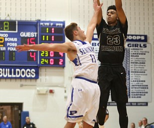 Harding's Dom McGhee (23) goes up for three as Poland's Brandon Barringer (13) attempts to block his shot in the second quarter of an AAC high school basketball game, Tuesday, Dec. 5, 2017, in Poland. Poland won 57-40...(Nikos Frazier | The Vindicator)..