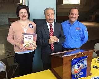 Bryan Higgins, Rotarian, introduced speaker Jim Ferraro, Western Reserve Transit Authority director, at the Struthers Rotary Club’s October meeting. The WRTA initially was funded by an assessment to property taxes in Youngstown, but with the devaluation of city properties over the years, the funding was modified to a sales-tax basis. The WRTA now serves all of Mahoning County, and its primary service is the movement of workers to and from jobs. At right, from left, are Jennifer Johnson, Rotary president; Ferraro; and Higgins. Johnson holds a book that will be donated to the Struthers Elementary School library in Ferraro’s name in appreciation for his presentation.
