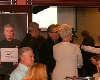 A picture of Boardman Police Chief Jack Nichols in a booking style photo during a retirement party honoring Chief Nichols, Wednesday, Dec. 6, 2017, at Magic Tree Pub & Eatery in Boardman. Chief Nichols will officially retire on December 31, after having served 40 years with the Boardman Police Department...(Nikos Frazier | The Vindicator)