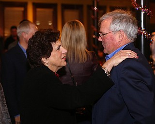 Mahoning County Commissioner Carol Rimedio-Righetti greets Boardman Police Chief Jack Nichols during a retirement party honoring Chief Nichols, Wednesday, Dec. 6, 2017, at Magic Tree Pub & Eatery in Boardman. Chief Nichols will officially retire on December 31, after having served 40 years with the Boardman Police Department...(Nikos Frazier | The Vindicator)