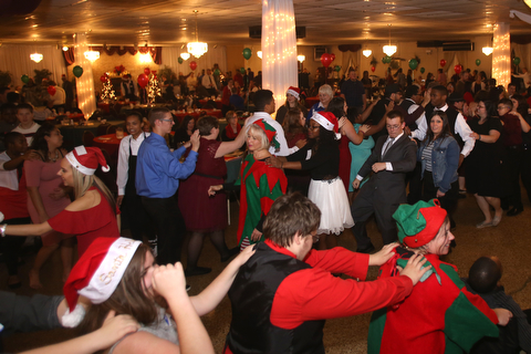 A conga line breaks out during the 13th annual Winterfest special needs dance, Wednesday, Dec. 6, 2017, at the Mahoning Country Club in Girard...(Nikos Frazier | The Vindicator)