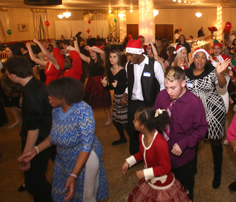 Students dance to the "Cupid Shuffle" during the 13th annual Winterfest special needs dance, Wednesday, Dec. 6, 2017, at the Mahoning Country Club in Girard...(Nikos Frazier | The Vindicator)