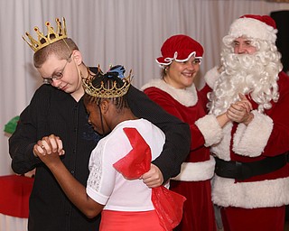 Nathan Smith and Andera West dance after being named the Snow Prince and Princess during the 13th annual Winterfest special needs dance, Wednesday, Dec. 6, 2017, at the Mahoning Country Club in Girard...(Nikos Frazier | The Vindicator)