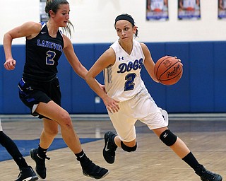 POLAND, OHIO - DECEMBER 6, 2017: Poland's Sarah Bury (2) drives past Lakeview's Lindsay Carnahan (2) during the.1st qtr. at Poland High School.  MICHAEL G. TAYLOR | THE VINDICATOR