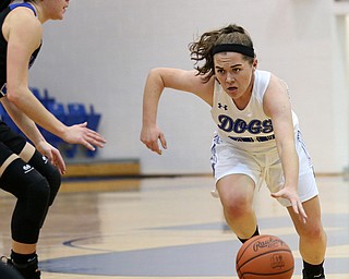 POLAND, OHIO - DECEMBER 6, 2017: Poland's Kat Partika (22) drives past Lakeview's Annie Pavlansky (33) during the.1st qtr. at Poland High School. MICHAEL G. TAYLOR | THE VINDICATOR