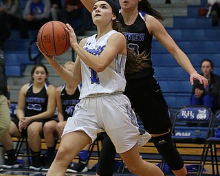 POLAND, OHIO - DECEMBER 6, 2017: Poland's Brooke Bobbey (1) drives as Lakeview's Annie Pavlansky (33)  defends during the 2nd qtr. at Poland High School.  MICHAEL G. TAYLOR | THE VINDICATOR
