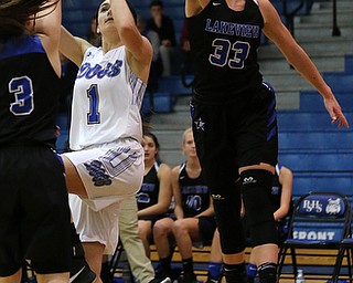 POLAND, OHIO - DECEMBER 6, 2017: Poland's Brooke Bobbey (1) has her shot blocked by Lakeview's Annie Pavlansky (33)  during the 2nd qtr. at Poland High School.  MICHAEL G. TAYLOR | THE VINDICATOR