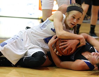 POLAND, OHIO - DECEMBER 6, 2017:  Poland's Bella Gajdosl (0) and Lakeview's Lindsay Carnahan (2) battle for the ball during the 2nd qtr. at Poland High School.  MICHAEL G. TAYLOR | THE VINDICATOR
