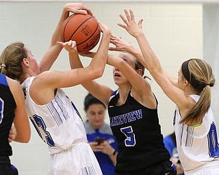 POLAND, OHIO - DECEMBER 6, 2017: Poland's Maggies Sebest (23) (left) and Poland's Bella Gajdosl (0) defend against Lakeview's Christine Innocenzi (5) during the 2nd qtr. at Poland High School.  MICHAEL G. TAYLOR | THE VINDICATOR