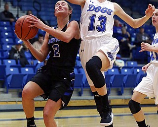 POLAND, OHIO - DECEMBER 6, 2017: Poland's Maggie Sebest (13) defends against Lakeview's Lindsay Carnahan (2) during the 3rd qtr. at Poland High School. MICHAEL G. TAYLOR | THE VINDICATOR