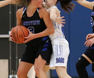 POLAND, OHIO - DECEMBER 6, 2017: Poland's Marlie McConnell (20) defend against Lakeview's Lindsay Carnahan (2) during the 3rd qtr. at Poland High School.  MICHAEL G. TAYLOR | THE VINDICATOR