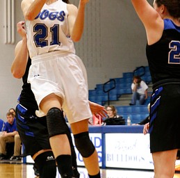 POLAND, OHIO - DECEMBER 6, 2017: Poland's Jackie Grisdale (21) drives past Lakeview's Annie Pavlansky (33) for the score during the 2nd qtr. at Poland High School.  MICHAEL G. TAYLOR | THE VINDICATOR