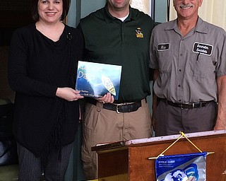 Rotarian Mike Krake introduced Dan White of the Ohio Department of Natural Resources Division of Wildlife at the Struthers Rotary Club meeting that took place in November. White has been a guest on the sportsman’s program that Krake hosts on WKBN. White’s function with the ODNR Division of Wildlife includes overseeing the distribution of hunting and fishing licenses along with observing, tracking and sampling fish populations in various waterways to assess their health and longevity. For information, visit wildife.ohiodnr.gov or on Facebook at www.facebook.com/ohiodivisionofwildlife. Above, from left, are Jennifer Johnson, Rotary president, presenting a book to White that will be donated to Struthers Elementary School in appreciation of his presentation; and Krake. 