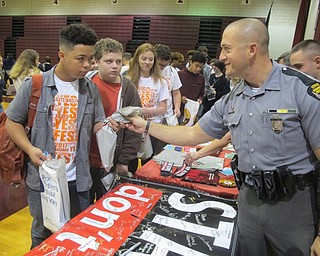 Neighbors | Zack Shively.Dan DeLuca of the State Highway Patrol met with students during the second half of the Yes Fest program in the gym. The patrol has Five Minutes for Life and other after school programs that educate students on drugs and promotes positive decision making.