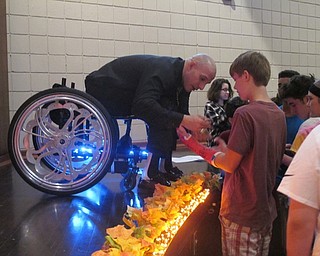 Neighbors | Zack Shively.Nick Scott gave students autographs, took pictures with students and talked to students after he spoke. His speech connected with the event's overall message to Say Yes to positive influences.