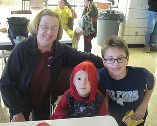 Neighbors | Zack Shively.Boardman High School staff came together for their Pumpkin Promenade on Oct. 27. The event had food, a photo area, a promenade and trick-or-treating. Pictured are, from left, Karen Piper, Parker Hughes and Kyle Hughes.