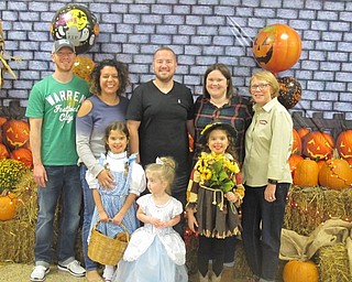 Neighbors | Zack Shively.The Kale Family posed for a photo at the photobooth set up by school for the Pumpkin Promenade. Families on Boardman High School staff came together for the event.