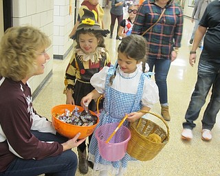 Neighbors | Zack Shively.The children of Boardman High School staff went around the first floor to trick-or-treat. They had staff in some classrooms to pass out candy to the children.