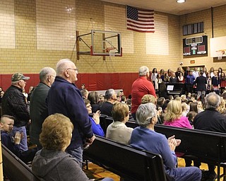 Neighbors | Abby Slanker.As the Canfield Cambiata performed “Salute to Armed Forces” at the Canfield Village Middle School’s annual Veterans Day Program, veterans in attendance stood and were recognized when the song from their branch of the military was presented on Nov. 10.