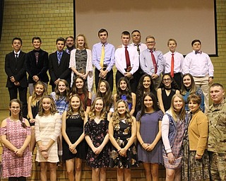 Neighbors | Abby Slanker.Under the direction of social studies teachers Mike Kerensky (back right) and Jason Jugenheimer (back left) eighth-grade student volunteers prepared and executed the Canfield Village Middle School’s Veterans Day Program, which featured Chief Warrant Officer 3 Russell Conwell Haddon III of the United States Army (front right) as the guest speaker on Nov. 10.