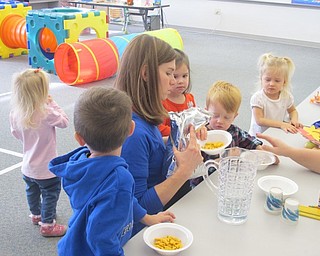 Neighbors | Zack Shively.The children at "Mommy and Me" preschool program at Poland North Elementary had a small snack after having played and crafted.