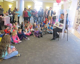 Neighbors | Zack Shively.Drag racer Ryan Martino read two stories at the Disney Princess and Superhero Breakfast. Martino and the Public Library of Youngstown and Mahoning County work together on several events throughout the year.
