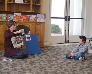 Neighbors | Zack Shively.Nikki Puhalla read "There was an Old Lady who Swallowed a Turkey" at the Austintown library's Baby Brilliant: Pre-Kindergarten Story Time on Nov. 22.