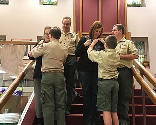 Neighbors | Submitted .Each time a Scout is presented with a rank award, he also is presented with a rank parent’s pin, which he then presents to his mother. Pictured is newly minted Second Class Scouts Owen Bowser and Wesley Rich, presenting their pins to their moms, Heather Bowser and Leann Rich, with dads Aaron Bowser  Bill Rich watching.
