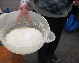 Neighbors | Zack Shively.Poland librarian Missy Williams gave no-knead bread recipes to those at the library for her "No Need to Knead" event on Nov. 20. Pictured, Williams mixed ingredients together to prep for no-knead bread.