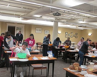Neighbors | Zack Shively.Missy Williams showed the group how to start to make no-knead bread, and then the group began to do it on their own. Williams walked around and helped everyone. She gave advice throughout the class.